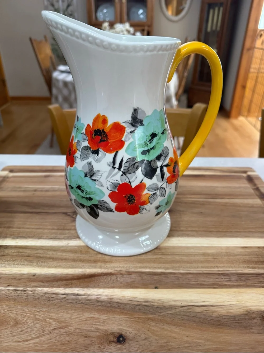 The Pioneer Woman Ceramic Floral Pitcher in Yellow, Red-Orange, and Mint